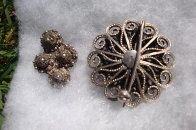 showing back of large brooch