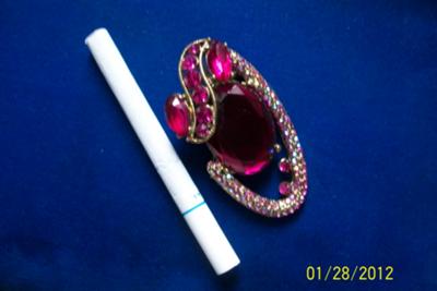 brooch near cigarette